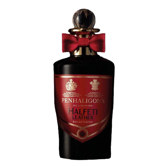 Penhaligon's Halfeti Leather perfume bottle with a red bow on a black background