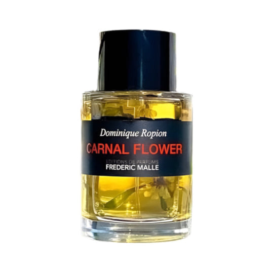 Perfume bottle labeled 'Carnal Flower' by Frederic Malle on a white background